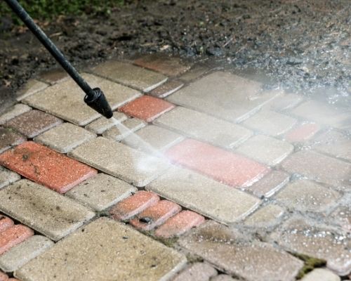 Applying High Pressure Cleaning Services To Paved Area