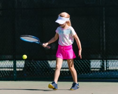 Girl Playing Tennis On Clean Hard Court